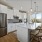 oversized island and quartz countertops in kitchen with windows