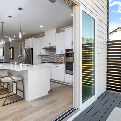 inside to outside kitchen bright kitchen with island and outside deck