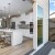 bright kitchen with island and outside deck