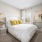 carpeted bedroom with large window