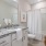 large bathroom with lighted vanity/sink counter